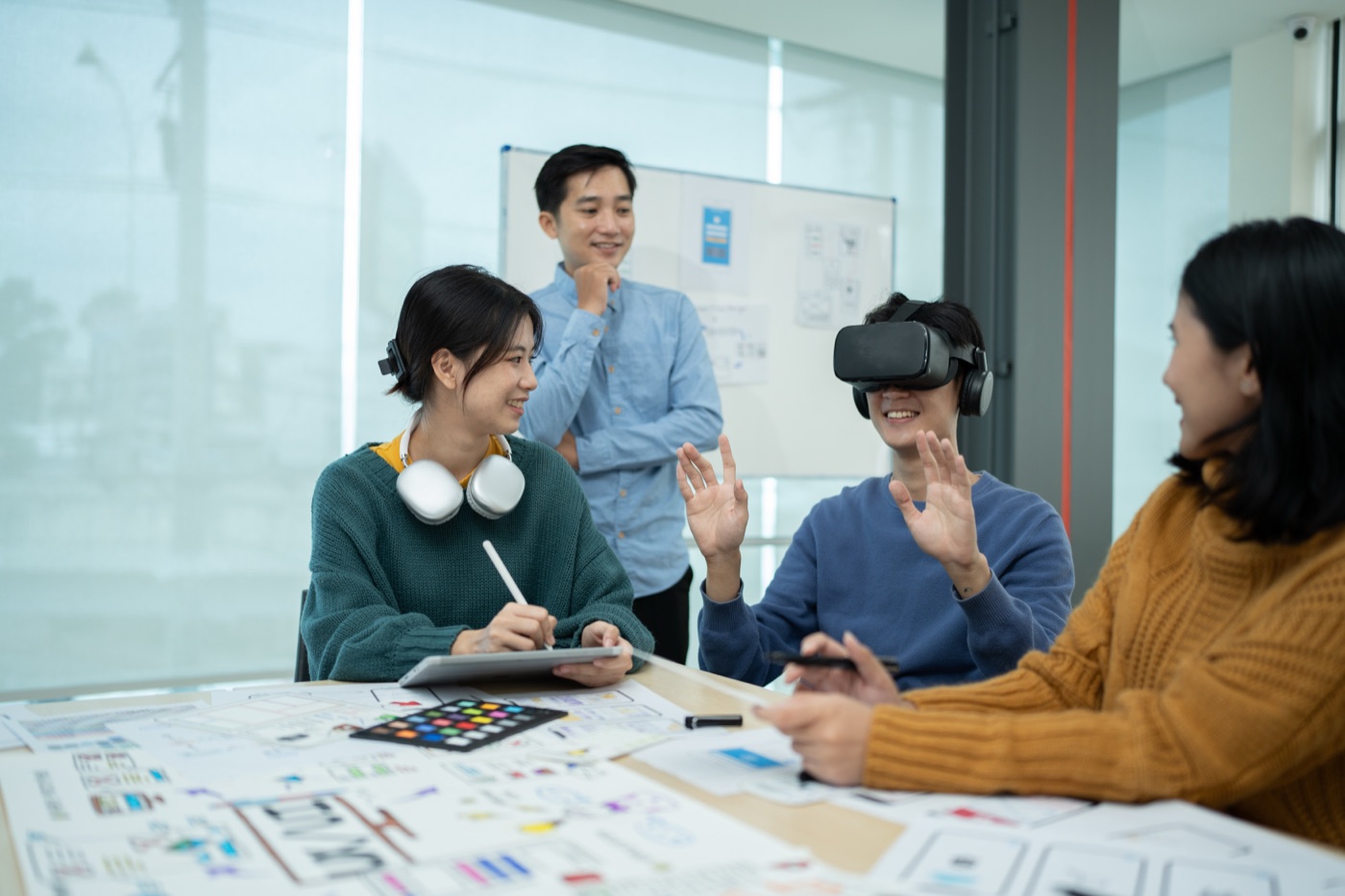 Creative team using VR and modern technology in an office