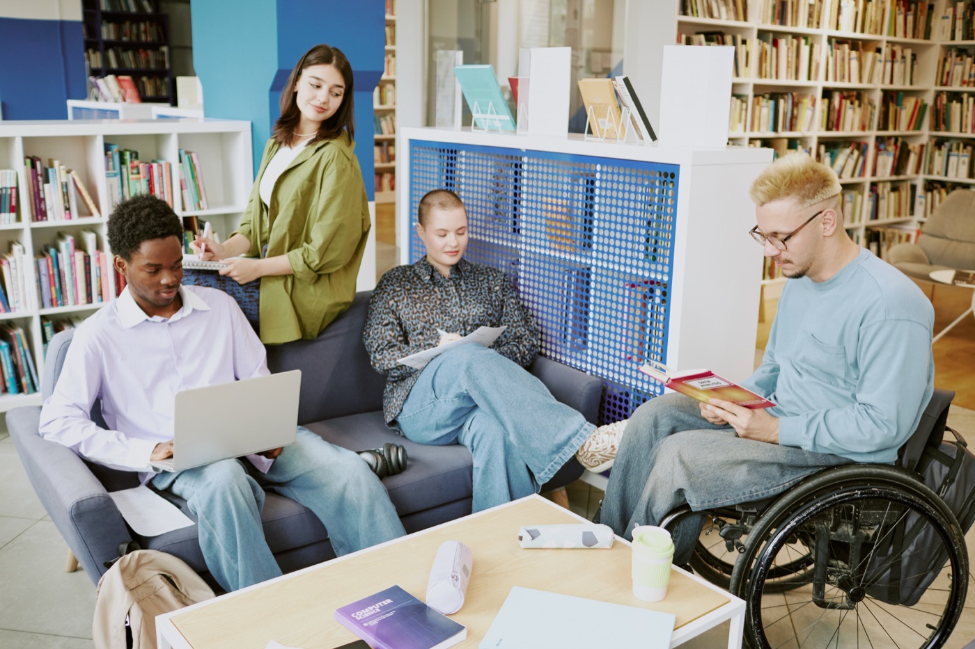 Diverse group of students working together in a library